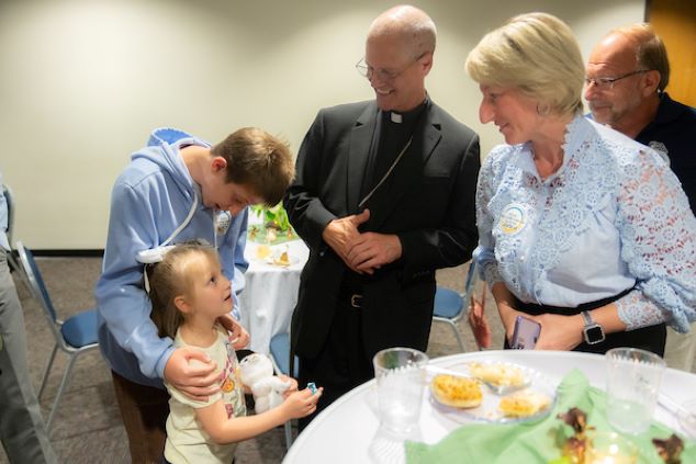 Archbishop Etienne getting to know some of the Welcome Circle families