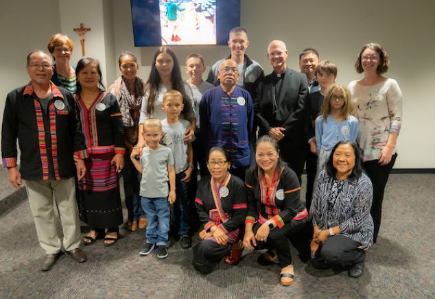 Archbishop Etienne poses for a picture with some of our Welcome Circle participants