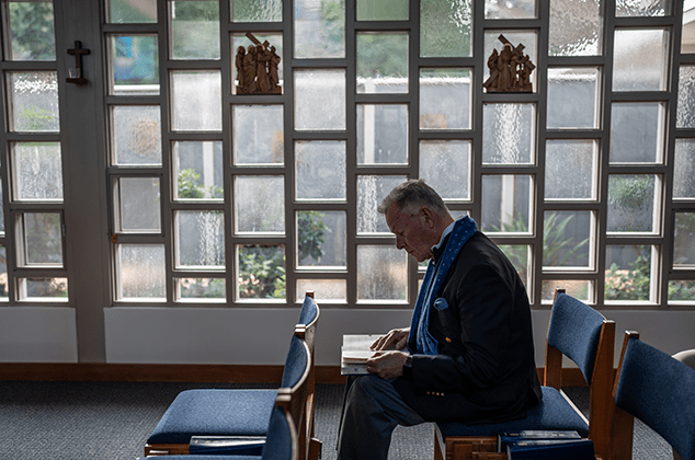 A man reading the Bible at the 2024 Crozier Lenten Retreat