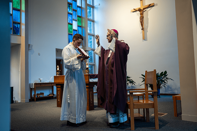 Archbishop Etienne leading a prayer at the 2024 Crozier Lenten Retreat