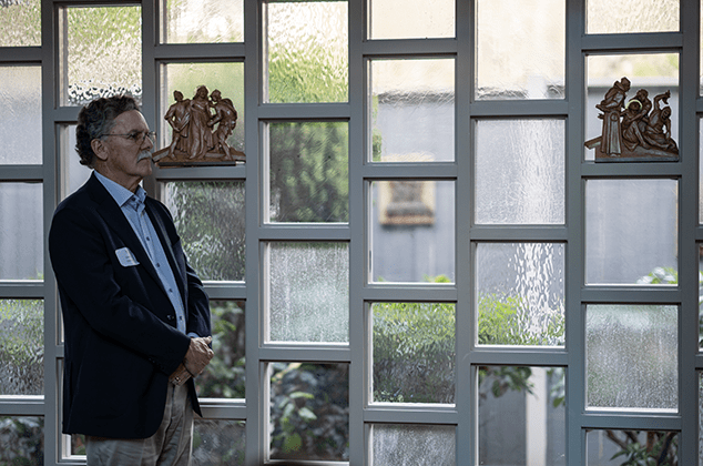 A man listening to a prayer at the 2024 Crozier Lenten Retreat