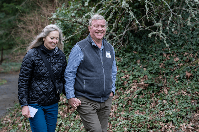 A couple walking and holding hands at the 2024 Crozier Lenten Retreat