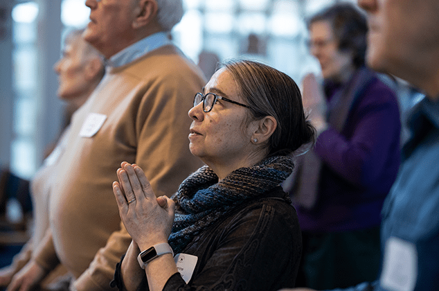 A woman praying at the 2024 Crozier Lenten Retreat