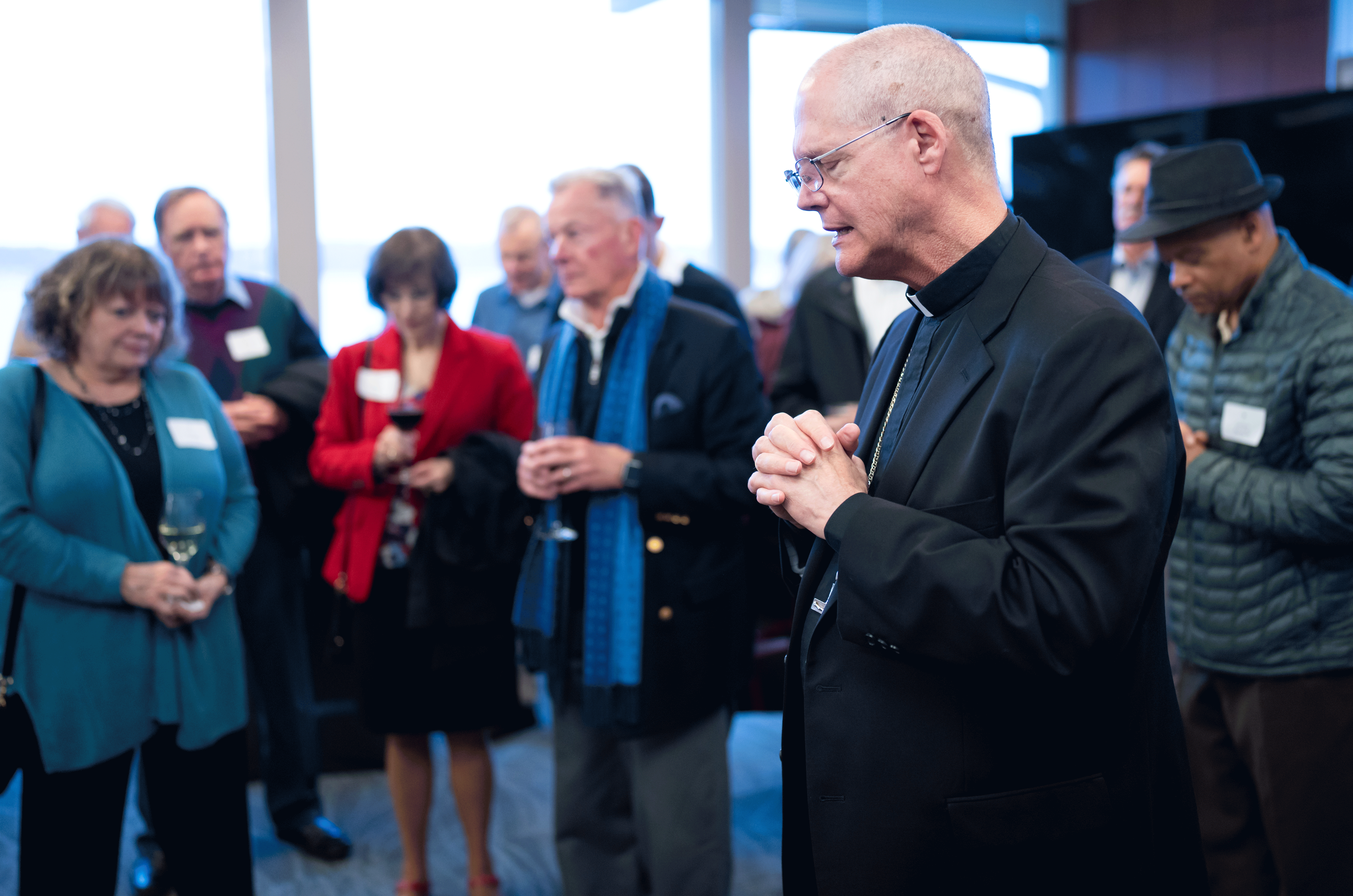 Archbishop Etienne praying at the 2024 Crozier Lenten Retreat