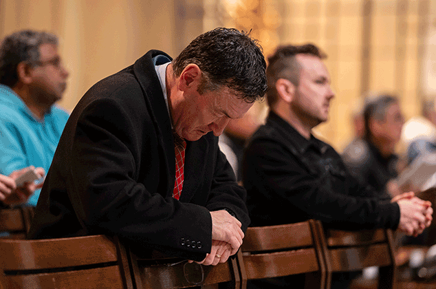 People worshipping at a Mass