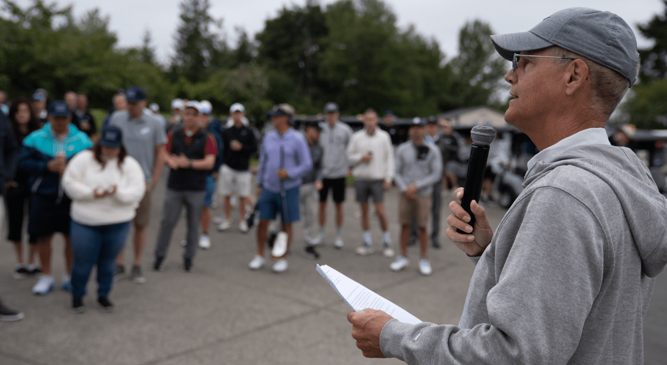 Archbishop Etienne speaking at a golf course