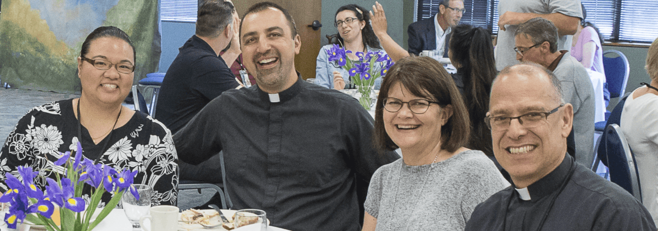 women-with-priests-sitting-at-a-table_H1-min